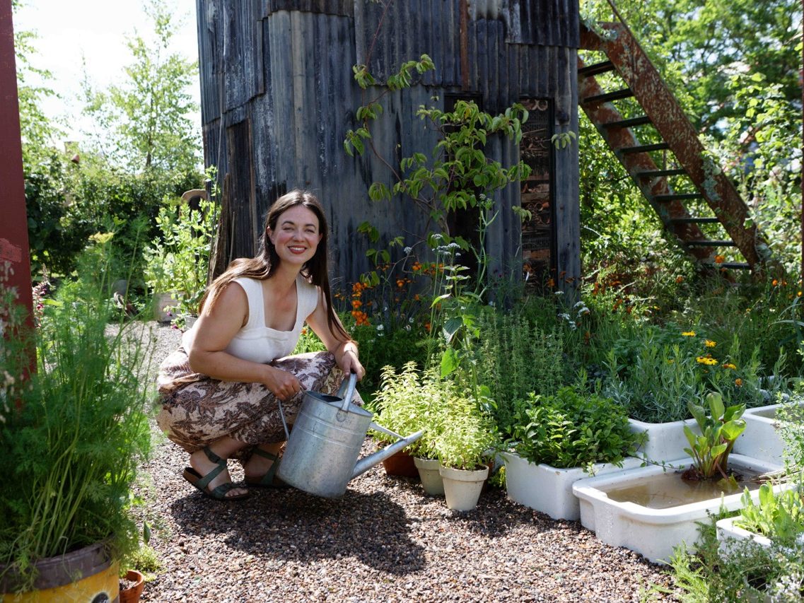 Woman watering in garden