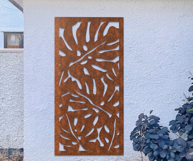 Corten Garden Screen in Monstera Design on a white wall