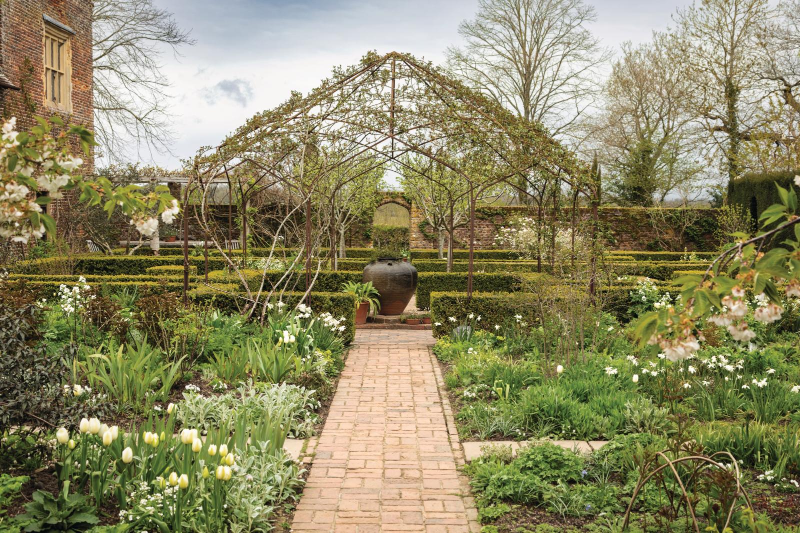 Visitors can walk underneath Sissinghurst’s White Garden pergola, which creates a central focal point
