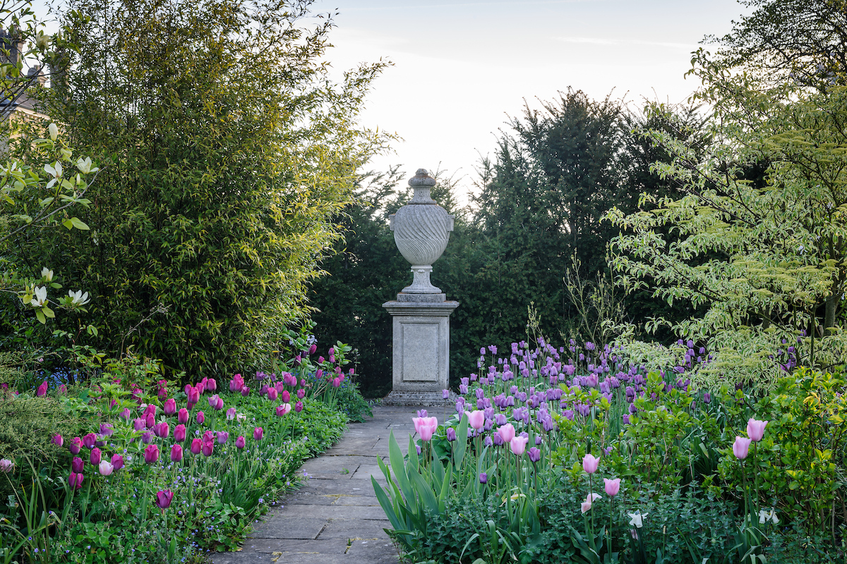 In Malverleys, a stone urn punctuates the space at the end of a path