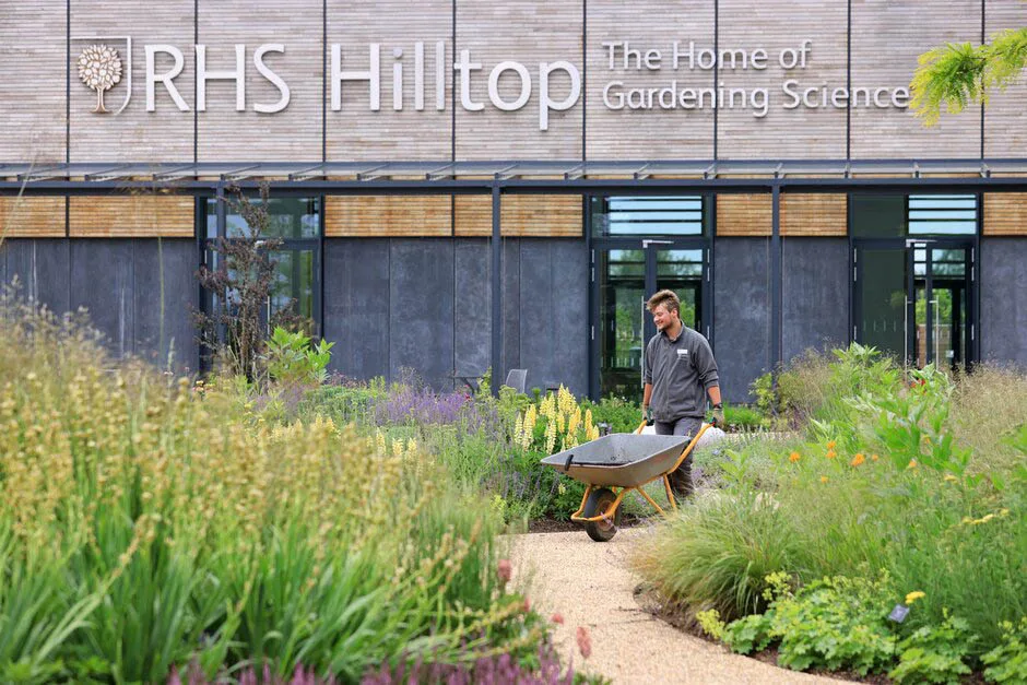 Aiden Couzens, horticulturalist, making final preparations to the Wellbeing Garden at RHS Hilltop ñ The Home of Gardening Science, at RHS Garden Wisley. June 2021. RHS Garden Wisley