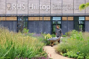 Aiden Couzens, horticulturalist, making final preparations to the Wellbeing Garden at RHS Hilltop ñ The Home of Gardening Science, at RHS Garden Wisley. June 2021. RHS Garden Wisley