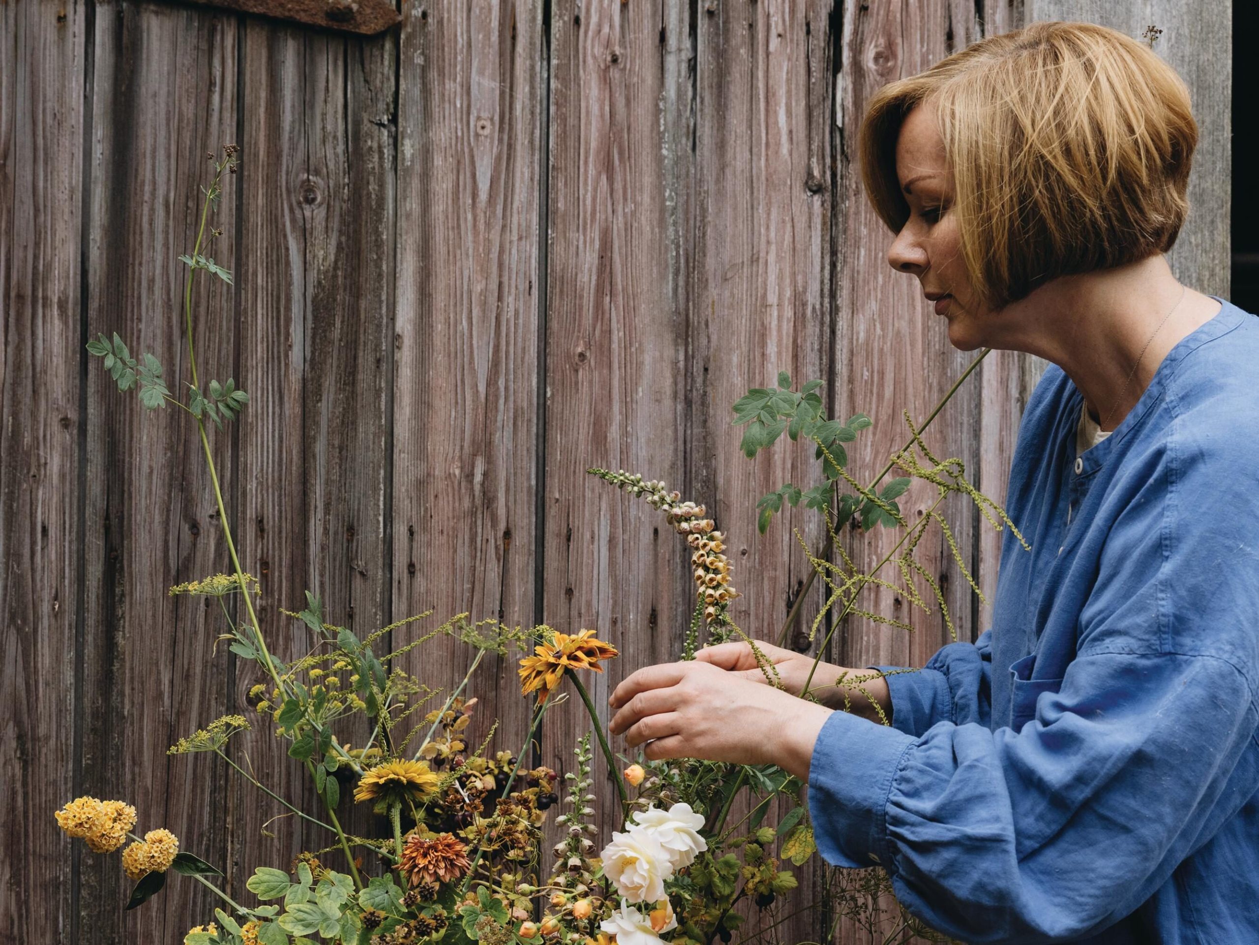 Woman arranging flowers