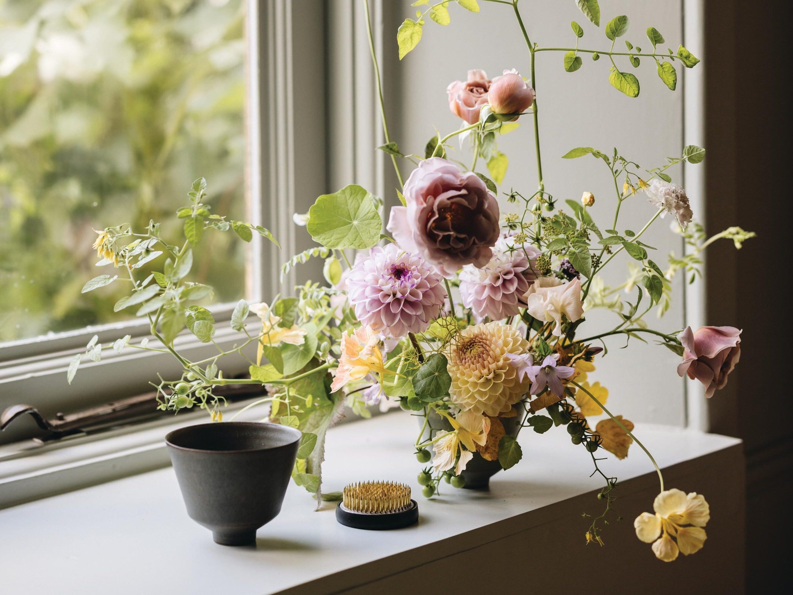 Flowers arranged by window