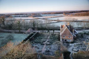 Winter at Sissinghurst Winter garden and house surrounded by countryside