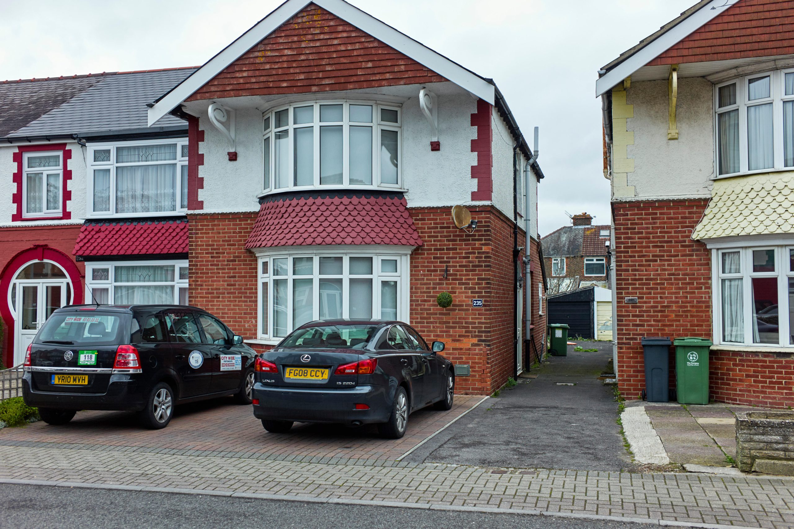 Paved over front gardens with drop down kerbs