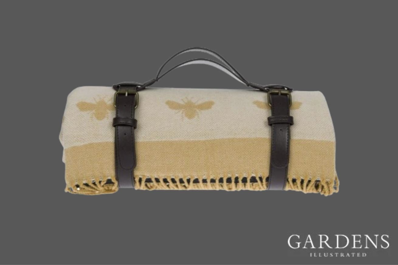 Sophie Allport Bees Knitted Picnic Blanket on a grey background